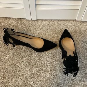 Black suede pumps with side ankle cut out and tassel back. Worn once